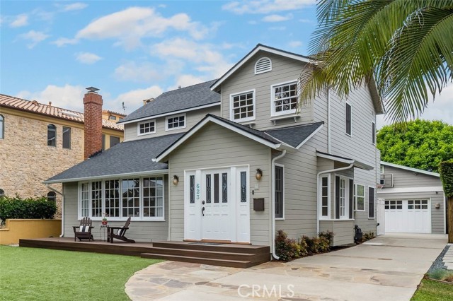 photo has been altered to show garage matching the house color