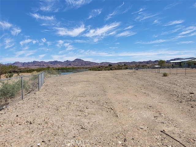 Property view from gate - fenced on both sides