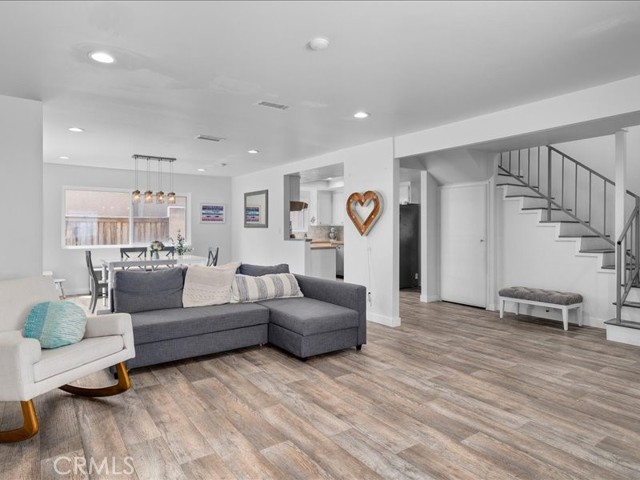 Living room opens to dining and kitchen