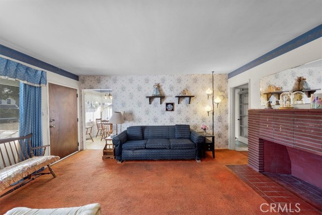 Living room with access to kitchen/dining area