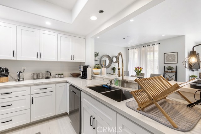 Remodeled kitchen with stainless steel appliances, quartz countertops, newer cabinetry