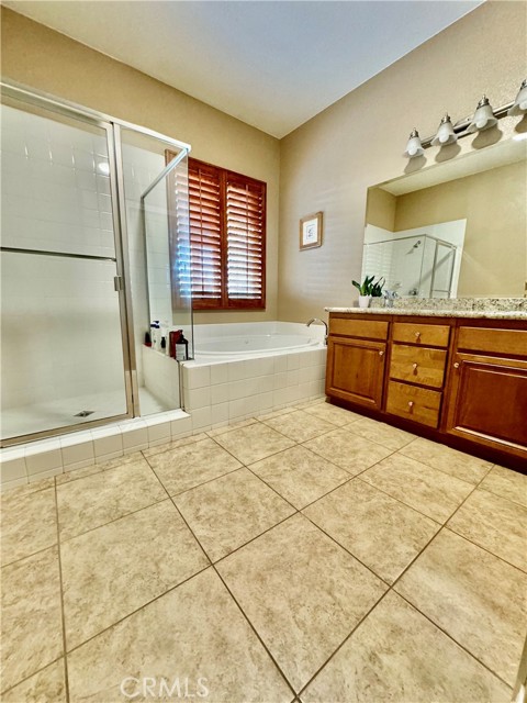 Master bathroom with dual sinks, oversized tub and separate shower.