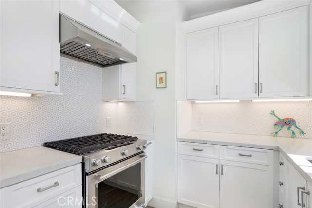 Front unit Chef's kitchen with top of the line stainless steel appliances.