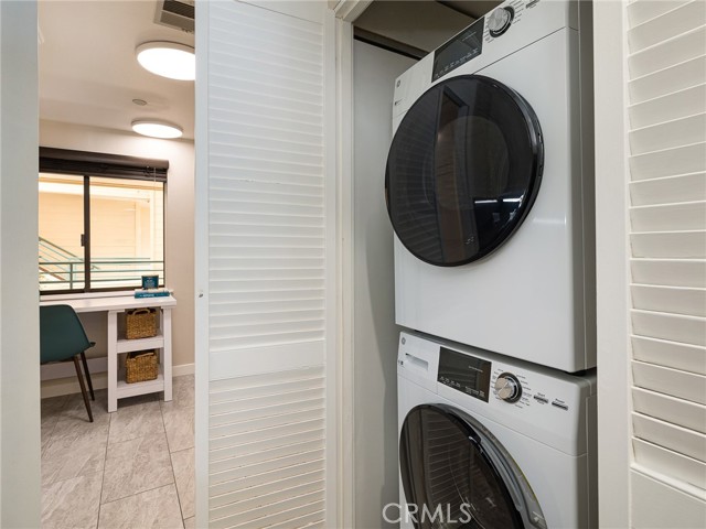 washer & dryer in the back of the kitchen in its own cupboard