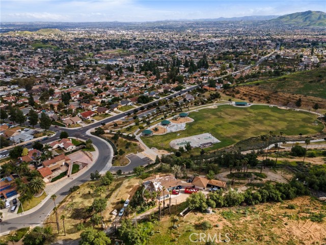 The home and extra lot is in the bottom portion of photo.