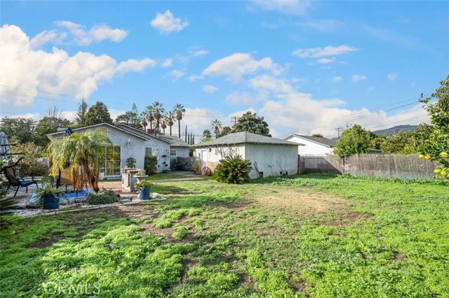 Large grass area, fruit trees, and a perfect place for a Victory Garden