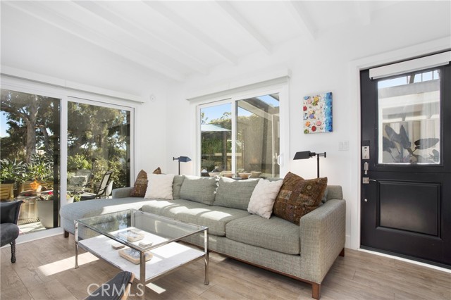 New sliding glass doors that open to the coastal canyon & lush garden