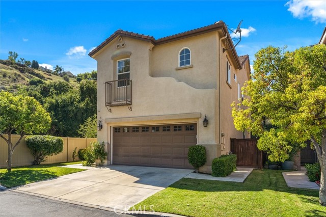 Welcome to this delightful two-story home in the heart of Castaic's Country Village! Nestled on a generous corner lot, this 1,994 sq ft residence promises an inviting and hassle-free living experience. You'll find tasteful finishes throughout, from the gleaming hardwood floors to the ambient recessed lighting with dimmers. The custom kitchen, complete with granite countertops and stainless steel appliances, is a chef's dream.

Step inside to discover a well-designed floorplan that combines comfort and functionality. The entire home has received a fresh coat of paint, lending it a vibrant and welcoming atmosphere. Upstairs, the master bedroom awaits with its convenient jack and jill sink, new custom tiling, and a luxurious soaking tub. Every bedroom offers plenty of closet space, and there's even a dedicated loft space, perfect for a home office.

For your convenience, the laundry room is thoughtfully placed upstairs, making laundry day a breeze. Outside, you'll be enchanted by the private backyard, enveloped in lush greenery, creating a peaceful oasis. This fantastic neighborhood offers numerous perks, and we encourage you to seize this opportunity to make this wonderful home your own. Don't wait – come and experience it for yourself today!