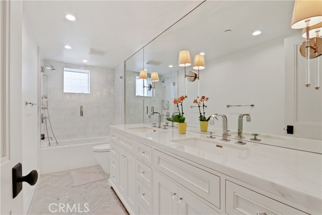 Lower level bathroom with dual sink vanity