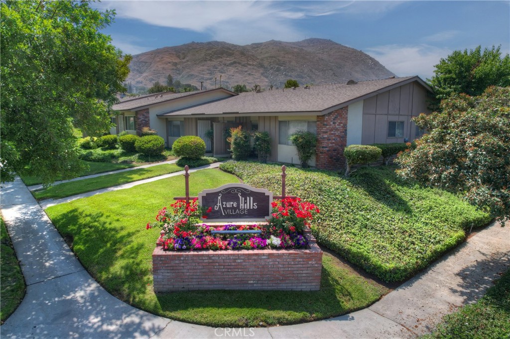 Beautifully renovated single story condo in the highly desirable Azure Hills Village complex, nestled in the foothills of Grand Terrace.  There are 3 bedrooms and 2 bathrooms, a nice sized detached 2 car garage (480 sq. ft.) and a private back patio for outdoor fun and relaxation. The primary bedroom suite has 2 closets, a private bathroom and direct access to the back patio area. Upgrades include new flooring throughout, with Luxury Vinyl Planking in the kitchen, bathrooms and third bedroom (flex space could be sunroom/den/office).  New paint provides the perfect neutral palette for the entire home. The stylish kitchen boasts new GE stainless steel appliances: refrigerator (with ice maker and water dispenser), self cleaning stove/oven with adjustable cooktop and dishwasher.  The custom granite countertops are stunning and provide plenty of workspace plus bar seating. Additionally there's a new sink, faucet with sprayer, garbage disposal, undermount task lighting and cabinet hardware. You'll love being the cook in this modern and fresh space.  The kitchen is open to the living room and dining area, it's perfect for every day life and for entertaining.  Energy saving features: brand new high efficiency heat/air system with new ducts and registers, new high efficiency water heater, custom window coverings will minimize heat/cold transfer, LED lighting, and the kitchen appliances are energy saving too! Both bathrooms have new vanities and faucets, low-flow toilets, upgraded matching towel racks, hardware and modern light fixtures. There's extra storage in the hallway. The private back patio area is the perfect oasis to entertain, dine outside, enjoy a firepit or just relax under the stars and fun party lights. Azure Hills "Village" has lovely grounds, a pool/spa with mountain and city light views, clubhouse, landscaping maintenance and it's well lit during the evening. Located close to Loma Linda(LLUMC), and close to the 10, 215 and 91 freeways. Shopping, restaurants and grocery store are nearby.  It's always nice to be the first to live in a newly renovated and super clean space. This is the perfect condo, complex and location to call home.  Welcome to the "Village".