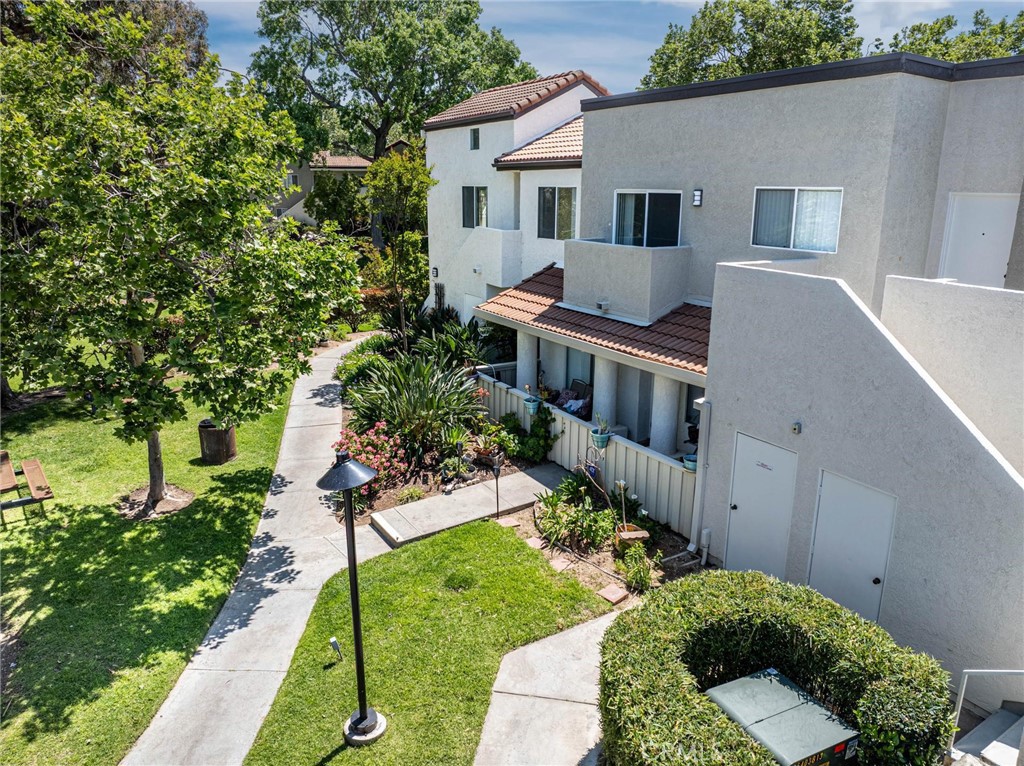 VIEWS! VIEWS! VIEWS! Arguably the best location in the Vistas Community. This private upper end unit condo has only one shared wall and overlooks the large greenbelt area and Placerita Canyon. This 2 bedroom, 2 bathroom model is often referred to as the “double primary.”  The open floorplan offers lots of natural light. Kitchen cabinets have recently been painted white to match the white fridge and white oven. Plush neutral colored carpet throughout. Two private balconies with incredible mountain views, one off the living room and another off the primary bedroom.  In-unit washer & dryer and a tandem 2-car garage with additional bonus storage space under the unit. Outstanding HOA amenities include pool, spa, picnic areas, green belts, tennis court and playgrounds. Truly has it all. Close to shopping, restaurants and excellent freeway access for your commuters.
