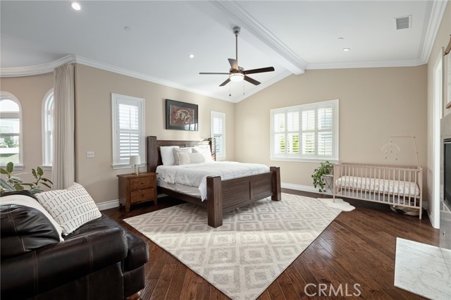 primary bedroom with vaulted ceilings