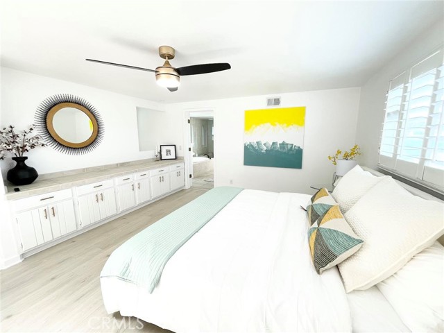 Bedroom is filled with natural light from the sky light