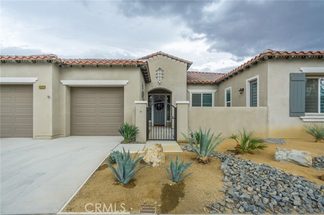 43426 Hazelton Lane Indio, California This 3 year new pool home is located in the quaint gated Yorkville community of Bermuda Dunes. At 2,568 square feet it features 3 bedrooms, 3.5 baths and a 4th room that can be a home office. The primary suite is very private because it is on the opposite wing of the home from the 2 secondary bedrooms. The primary bedroom features a large walk-in closet and a bath with dual sinks, shower and large soaking tub. The living area is great room style with 12 foot ceilings that encompass a formal dining area, living room with a fireplace and the kitchen with a large island. From all these areas you look out at the lovely backyard with a salt water pool and spa. There is a large covered patio so that you can enjoy barbequing and entertaining on warm summer days. The 3rd bedroom and bath is perfect for guests because it has its own exterior access door from the front courtyard. Everything in the home is top of the line, from the whirlpool appliances, granite counters, to the beautiful white marbled tile floors in the living areas. Other highlights include a 5 burner cooktop, custom window blinds throughout, tankless water heater, wired for a security system, ring doorbell. 3 zone thermostat, a very efficient Pentair Salt Water pool filter, 18 sear AC, artificial turf in the backyard, a large laundry room with cabinets and sink and extended length garage with epoxy floors. This home has a lot to offer to its next owner. It is a must see.