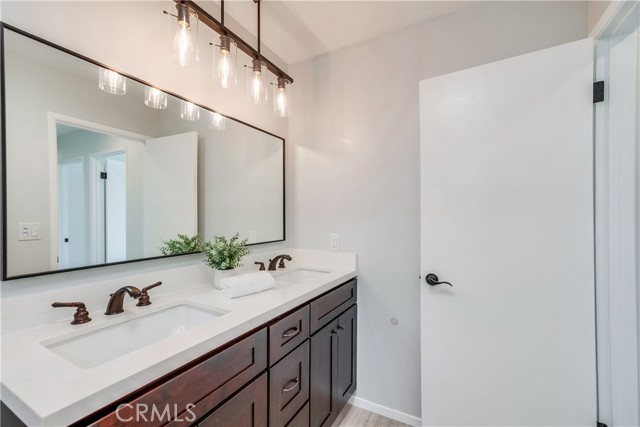 Full bathroom with double sinks secondary bathroom