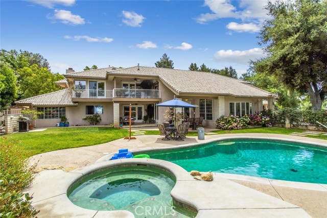 37546 Canyon Hills Drive Yucaipa, California PROUDLY PRESENTING 37546 Canyon Hills Dr. BOASTING OVER 4000 sqft in a prestigious neighborhood in the hills of Yucaipa, this CUSTOM BUILT HOME comes with many things to offer and plenty of space for your enjoyment. Grand high-ceiling entryway and elegant door welcome you into the foyer of this beautiful home. To the right, you will find a formal dining room with privacy double doors that connect to the kitchen. To the left, a large open room (currently a game room) beaming with natural light and amazing views of the mountains. Very spacious living room comes with french glass doors leading to the backyard where you will be greeted by: Gorgeously done landscaping, green grassy areas, 2 covered patio areas with fans, a sparkling pool with solar heating panels, a spa, and gorgeous nature views! Back inside, the open chef's kitchen comes fully equipped with top-of-the-line appliances, luxurious Thermador built-in double wall ovens, Sub-zero refrigerator, Thermador range, eat-in area, kitchen island with extra sink, and more. The 4 spacious bedrooms, 3 upgraded bathrooms as well as a large laundry room, are all located on the main floor. On the upper floor, there is a large loft you can use as an office, reading room, craft area, or anything that accommodates your lifestyle. It comes with built-in storage cabinets, granite countertops, and access through the french doors to a lovely balcony where you can enjoy the amazing views and captivating sunsets. Your massive master suite awaits behind the double doors. Romantic fireplace with wood mantle and large raised hearth, master bathroom with double sinks, tub, and separate shower. Relax, unwind, and enjoy the endless views in the master room sitting area, or step out to indulge in some fresh air on the balcony. Spacious 3 car garage with brand new garage doors. Rv/boat parking on the side of the house. Recently installed landscaping lighting enhances the outdoor beauty at night. 3 newer AC units. 6x16 TuffShed for added storage. From cooling off in the pool in the summertime to enjoying occasional mild snowfalls in the winter, this home offers the opportunity to enjoy and comfortably experience all seasons throughout the year.
