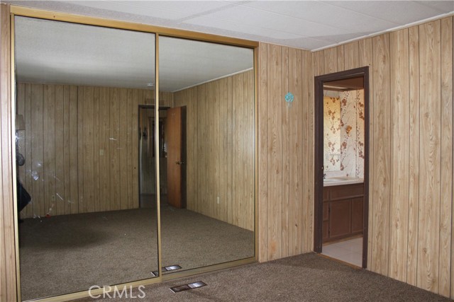 glass doors in primary bedroom closet