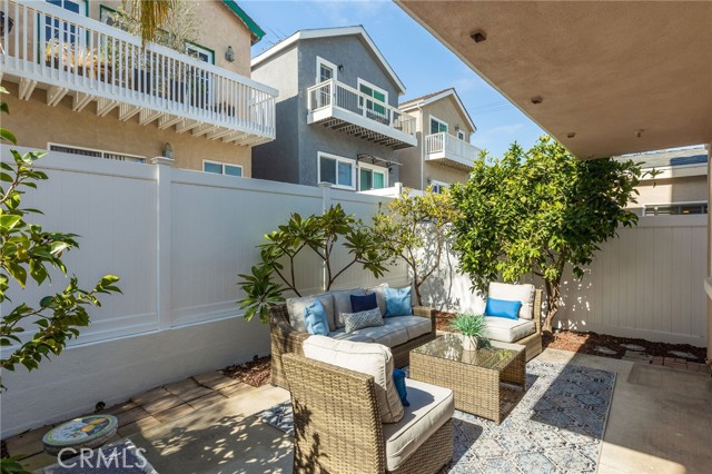 Warm in the afternoon sun enjoying the landscaped backyard w/mature trees.