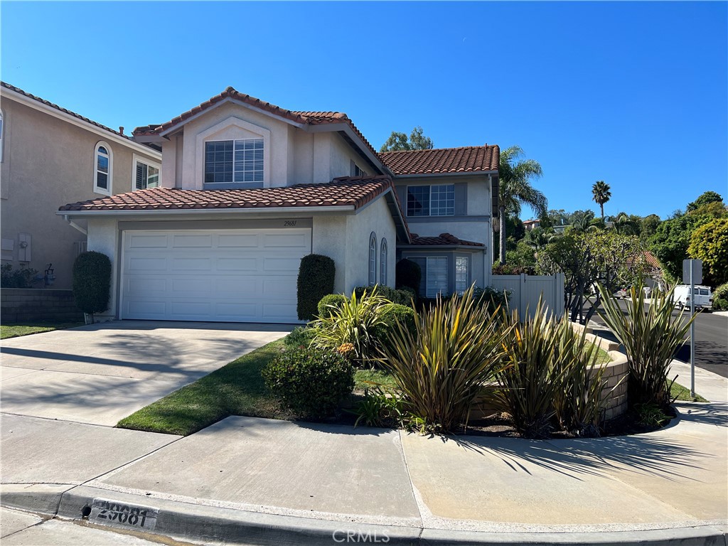 Beautiful Laguna Crest Home in a quiet neighborhood.  Newly refurbished with new interior paint, new LVP wood look flooring, quartz countertops.   Wonderful curb appeal, double door entry with spacious living room and formal dining room.  Family room with fireplace and wet bar.  Large primary suite upstairs with walk in closet, and wall closet.  All upstairs bedrooms have closet organizers.  Secondary bedrooms are well sized and adjacent to hall bath with quartz counters. The kitchen features quartz countertops, double ovens, newer dishwasher, gas cooktop, and breakfast nook overlooking the patio.  Entertain in your private backyard with patio and lawn area.  Close to schools, several markets, restaurants, and beaches.
