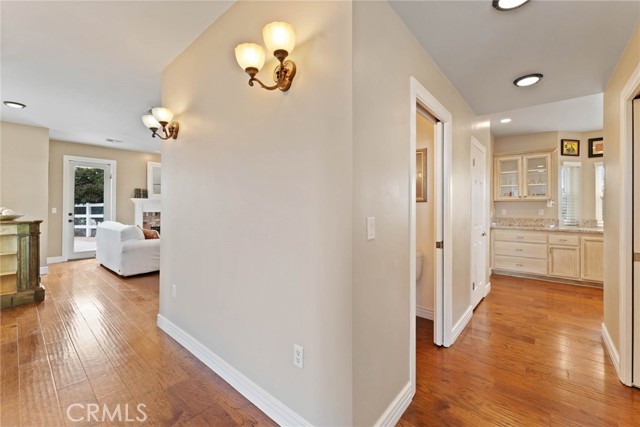 View from beside the entryway looking both toward the kitchen and living room