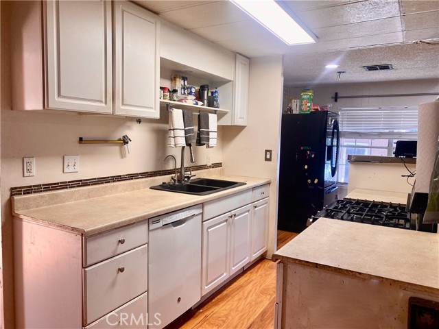 Kitchen area with extra cabinet and pantry space off to the side. Not pictured.