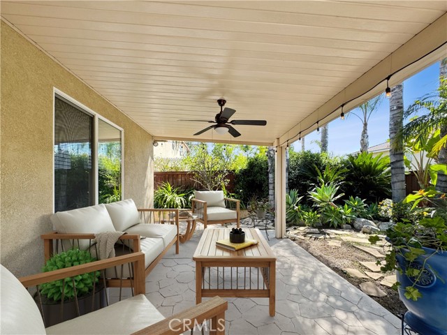 Rear outdoor living area space. Photos depict virtual staging and are not representative of current furnishings in the home.