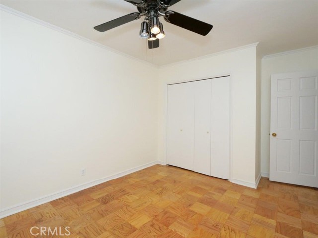 Bedroom 3 showing refinished floors, ceiling fan and freshly painted room