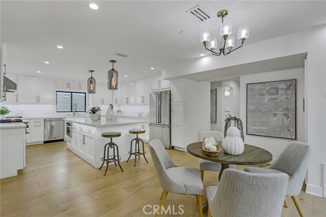 Gourmet kitchen with cozy dining area