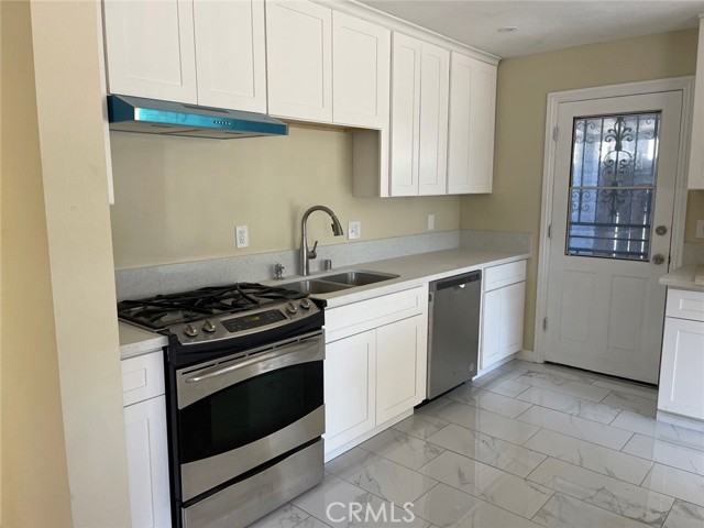 NEW CABINETS WITH STAINLESS STEEL APPLIANCES