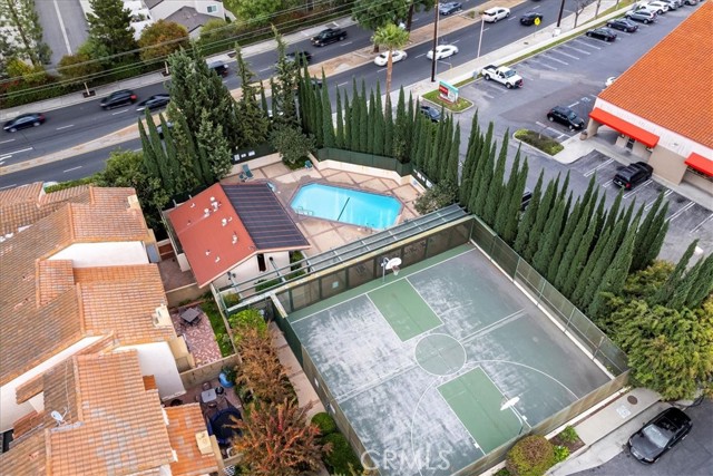 Community area including a pool and basketball court