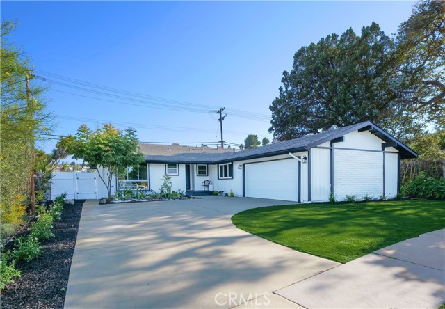 Front of house with extra long driveway