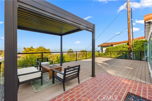 Stunning views to the city and ocean.The lush lawn and landscaping add the home\'s charm.