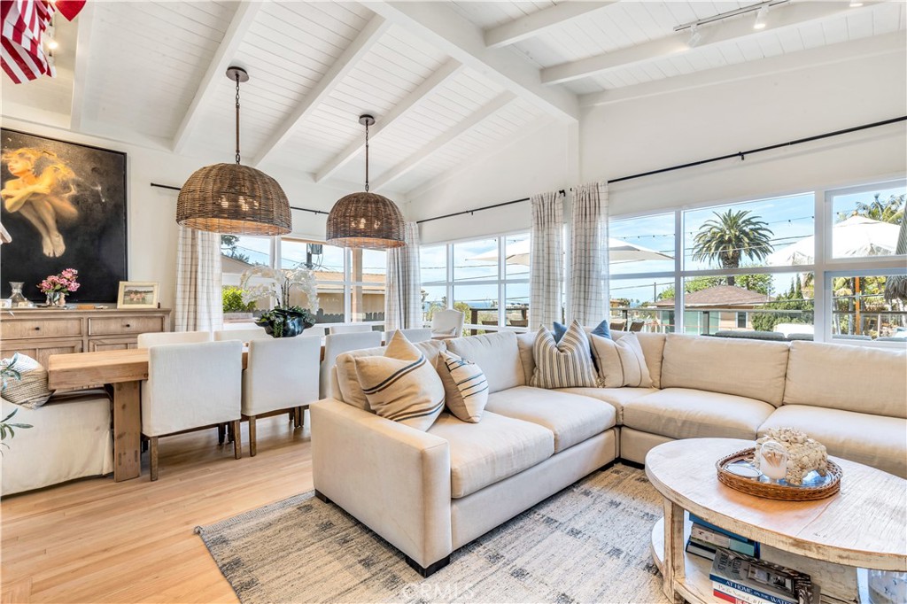 This home sits on a oversized R2 lot, spanning on 7500 square feet of flat, level, and usable space perfect for a ADU (Additional Dwelling Unit). Whether you're seeking a huge backyard for entertaining or developer seeking expandable ocean view square footage. Discover the pinnacle of coastal living with its stylish design with an open light and bright kitchen, complemented by gleaming naturally finished hardwood floors throughout which unfolds to a huge wrap around open deck with views of Pearl Street Beach, offering a seamless blend of indoor-outdoor living. Just a block and a half of Pearl and Woods Cove Beaches.