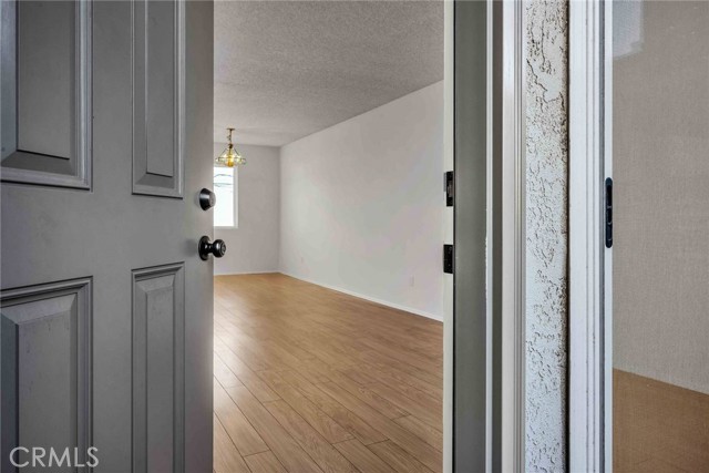 Wood laminate flooring in the living room, dining area and kitchen