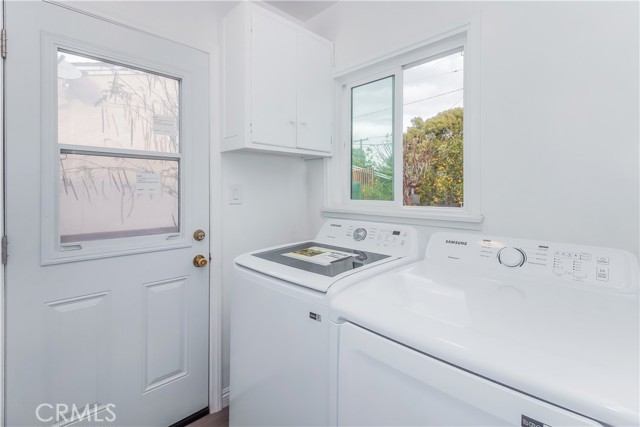 Laundry room in main house, leads to back yard