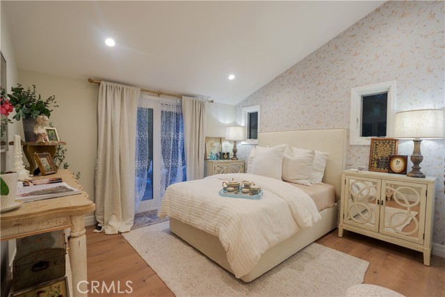 The entry level ensuite bedroom is a serene retreat featuring a beautifully appointed 3/4 bathroom and direct access to the tumbled marble deck.