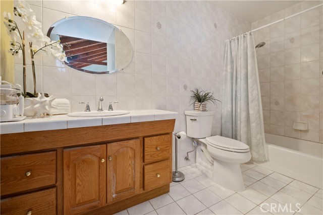 Primary bathroom with tub and shower combo.