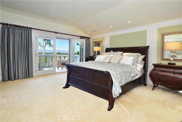 Master bedroom with huge balcony overlooking gorgeous pool area