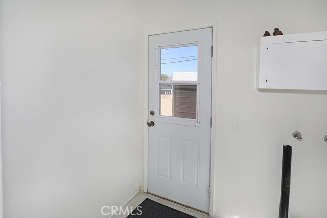 The laundry room has built in cabinets and leads to the garage and fully enclosed back yard.