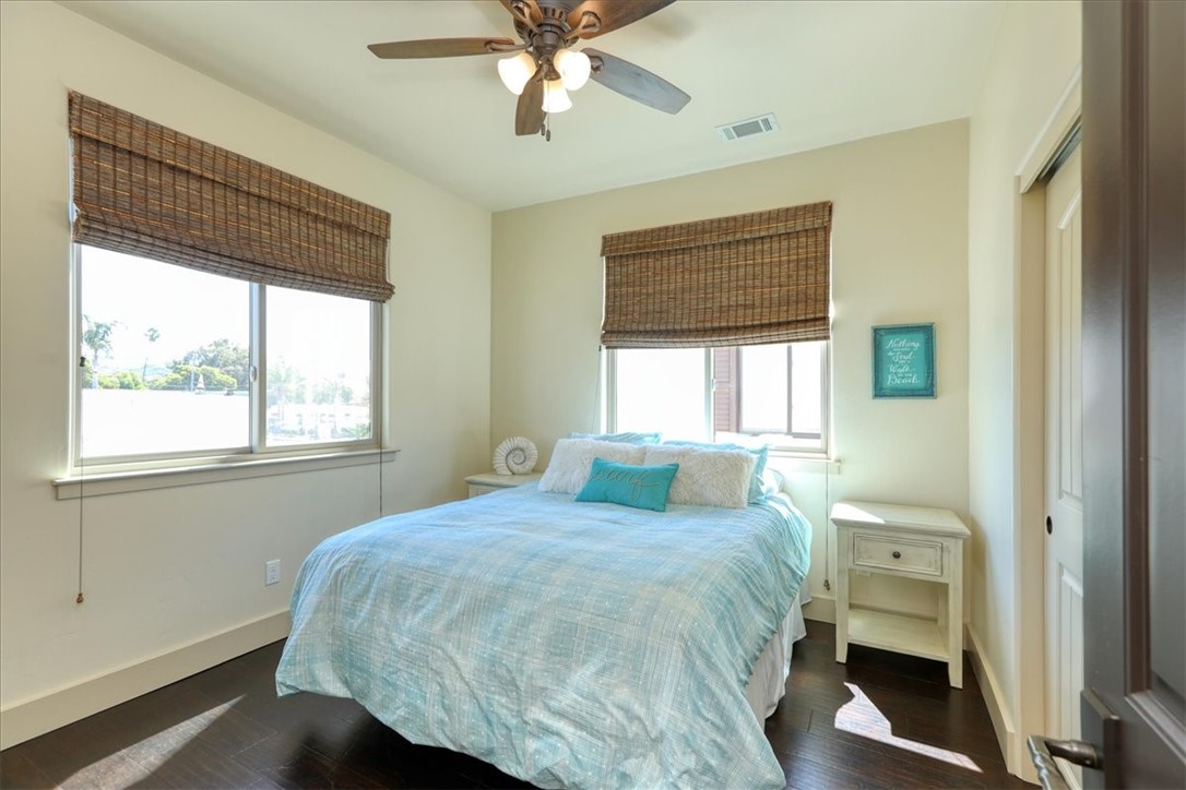 Guest bedroom with ceiling fan light fixture