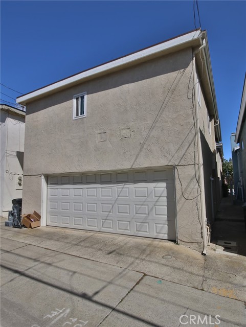 The two car garage at the rear of the building which is accessed by an alley behind the homes.