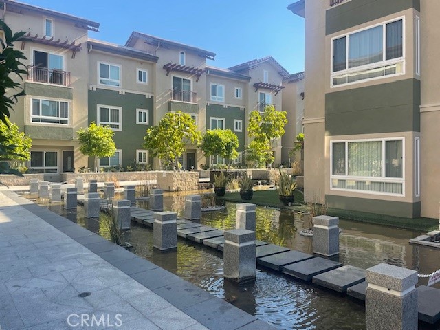 entrance to the building with the beautiful pond