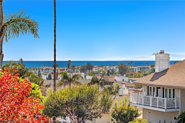 Peek a boo ocean views from the Primary Bedroom and upstairs balcony.