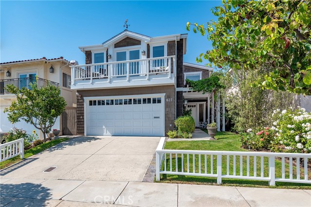 637 17th Street Manhattan Beach, California When location is important to you & your family, then you won't want to miss this coveted CUL-DE-SAC street. This A+ American Martyrs area location provides space, OCEAN VIEWS, and walkability, which is rare in Manhattan Beach. A traditional walkway, w/ vine covered pergola, leads from the white picket fence to the covered porch entry. You'll be amazed at the natural light & soaring ceilings and the fantastic double sided wood-burning fireplace in the living room. In addition, four of the upstairs bedrooms, offer very high ceilings. Ideal layout w/ 5 bedrooms upstairs & 1 bedroom w/ en suite bathroom downstairs. The extra large south facing master bedroom is bright w/ soaring ceilings & sitting area. The attached deck offers a work-from-home oasis. Enjoy your coffee & zoom calls amidst the cool ocean breeze & blue water / palm tree views overlooking the ocean sunset & Martyrs bell tower! Large great room on the main level is spacious with dutch doors opening onto the backyard & patio. Chef's kitchen w/ center island & freestanding counter bar area, perfect for gathering w/ family and friends. Outdoor space close to the beach is a commodity in MB + you have 2 large sundecks on the second floor & a fenced backyard w/ patio to enjoy the lovely year-round weather, well into the evening. Attached 2 car garage + 2 pkg spaces. Bullseye location on a 130' deep lot - just a short walk to the beach, coffee shops, parks, greenbelt, schools, & downtown MB. Virtual tour available.