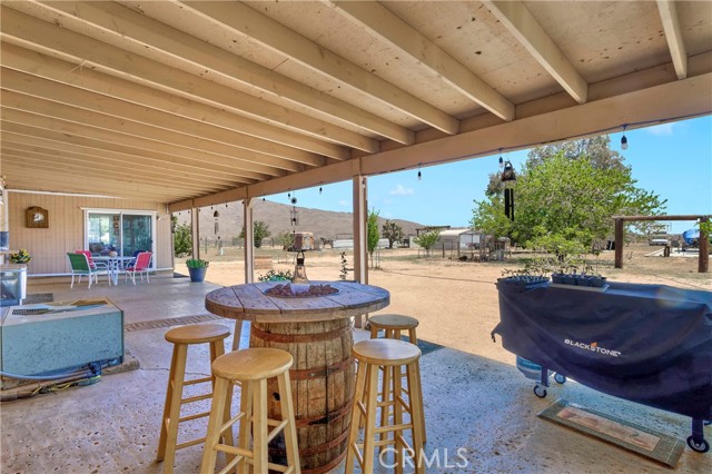 Large covered patio is the perfect space for al fresco dining, and all season outdoor enjoyment.