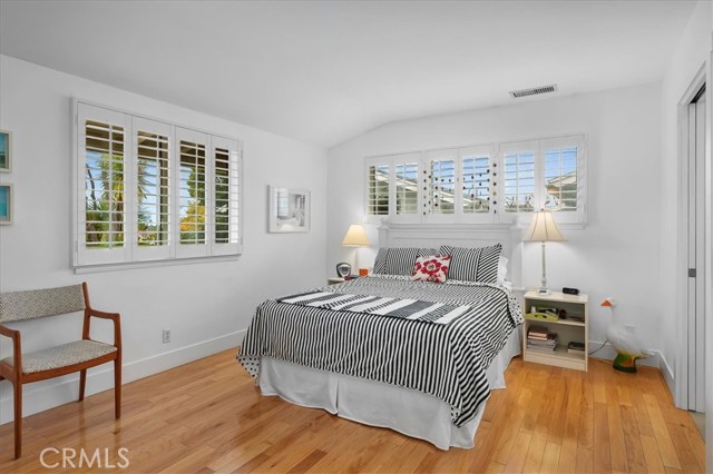 Two windows in the master suite provide tons of natural light in this cheery home.