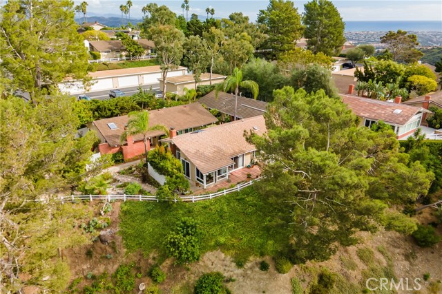 Perfectly set on the hill with serene views amongst beautiful trees and gardens.
