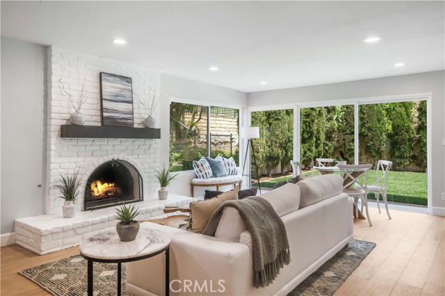 Great room opens to backyard. (photographer inserted fire for this photo)