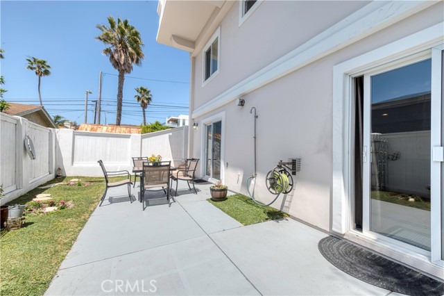 Backyard off bottom level accessed via family room.