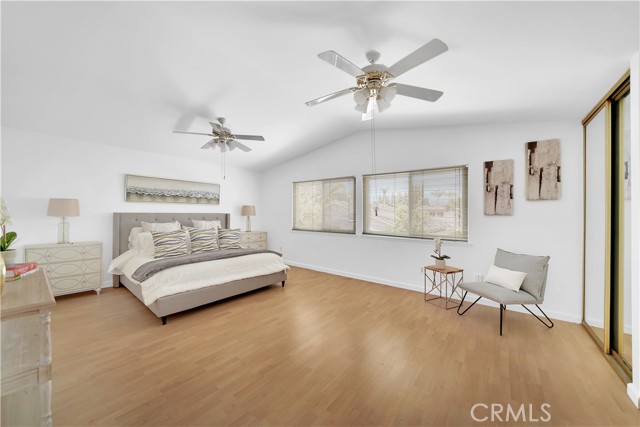 The double door master bedroom features high ceilings, a sitting area, and three closets, one of which is a walk-in closet.